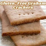 Crunchy, homemade gluten-free graham crackers arranged on a wooden surface.